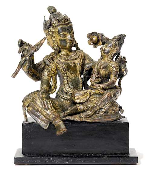 A GILT COPPER ALLOY FIGURE OF A GOD WITH HIS CONSORT.