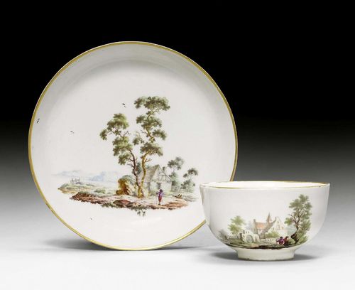 CUP AND SAUCER WITH LANDSCAPE DECORATION,Zurich, circa 1775. Underglaze blue mark Z and 2 dots. Slight chipping to foot edges, gilding somewhat rubbed.