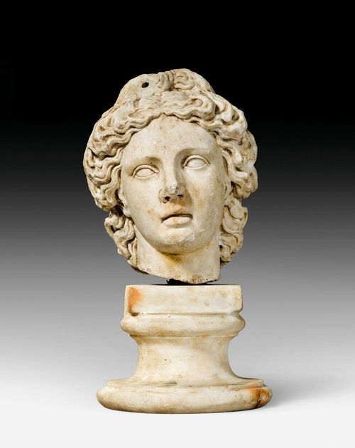 MARBLE HEAD,after Hellenistic models, probably Rome. White marble. Weathering and some losses. H 32 cm.