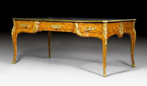 LARGE BUREAU-PLAT,so-called "bureau ministre", Louis XV, probably by J. DUBOIS (Jacques Dubois, maître 1742), Paris ca. 1745/50. Purpleheart and mahogany in veneer and inlaid with a lozenge pattern. Leather-lined top edged in bronze. Front with central drawer flanked by 1 drawer on each side. Same but sham arrangement on verso. Bronze mounts and sabots. Some losses. 199x99x80 cm. Provenance: - Formerly Antiquités Ribolzi, Monte Carlo. - Swiss private collection.