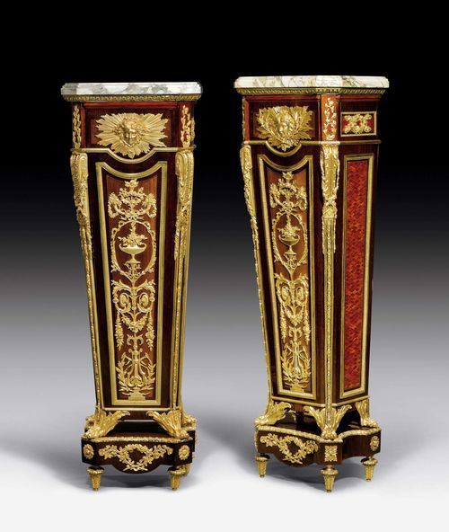 PAIR OF PEDESTALS,Regence style, Paris circa 1900. Tulipwood and rosewood in veneer. Rich gilt bronze mounts and applications. Beige/grey speckled marble top. 49x35x154 cm.