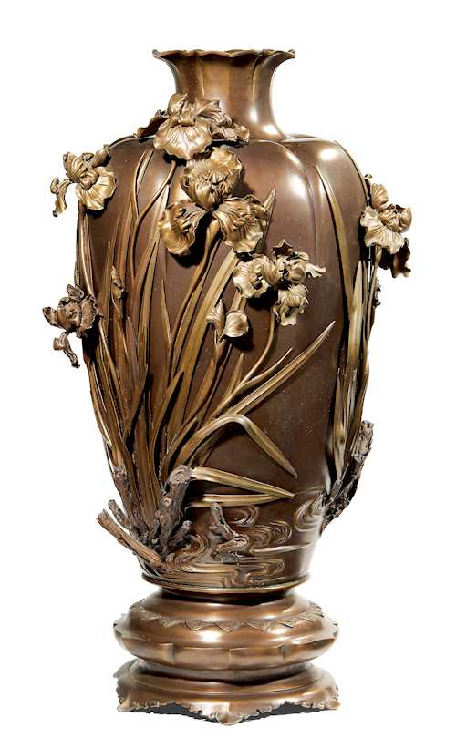 A LARGE VASE DECORATED WITH APPLIED IRIS.