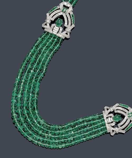 EMERALD AND DIAMOND NECKLACE. White gold 750. Classic-elegant, three-row and five-row necklace of numerous, graduated, facetted emerald beads of ca. 3 to 5.5 mm Ø, the sides decorated with 2 geometrically open-worked ornamental elements, each set with 1 emerald cabochon and set throughout with 14 square-cut emeralds, 17 baguette-cut diamonds and numerous brilliant-cut diamonds. Clasp additionally decorated with 1 emerald cabochon and small brilliant-cut diamonds. Total weight of the emeralds ca. 150.00 ct and total weight of the diamonds ca. 3.10 ct. L ca. 42 cm.