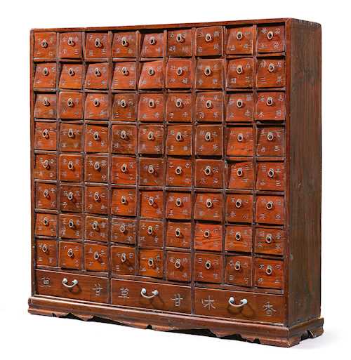 A WOODEN APOTHECARY CABINET.