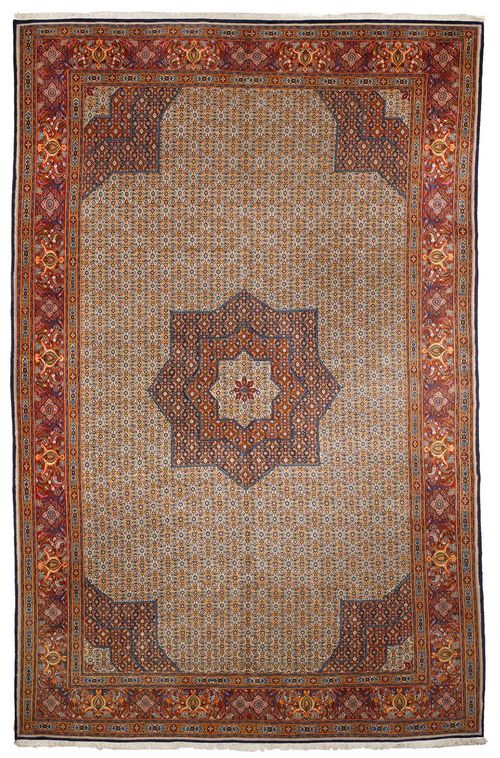 NORTH IRANIAN.Large medallion in white on a red, blue ground, patterned with a herati motif, red border with trailing flowers, 300x485 cm.