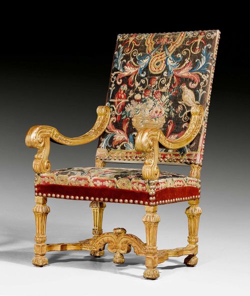 TAPESTRY FAUTEUIL "A LA REINE",Louis XIV, Paris circa 1700/10. Exceptionally finely carved and gilt wood. Fine tapestry cover with decorative nailwork. 63x48x47x114 cm.