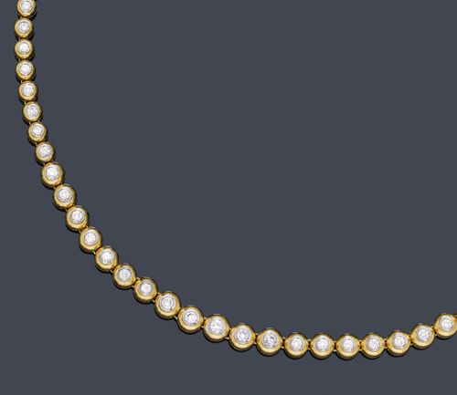 DIAMOND NECKLACE. Yellow and white gold 750, 52g. Casual-elegant Rivière necklace, set with 71 brilliant-cut diamonds, graduated, weighing ca. 3.50 ct, in half-spherical prong settings, L ca. 40.5 cm. Matches the following lot.
