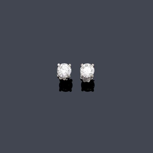 DIAMOND EAR STUDS . White gold 750. Classic-elegant solitaire ear studs, each set with 1  brilliant-cut diamond of 2.01 ct, I/VS2, and. 2.02 ct, I/VS1, respectively, in a classic four-prong chaton. With GIA Report Nos. 1146760341 and 1136560272, June and July 2012, respectively.