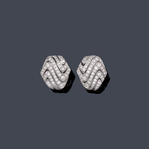 DIAMOND EAR CLIPS, CARTIER. White gold 750, 23g. Decorative, hexagonal, wave-like open-worked ear clips with studs, set throughout with numerous brilliant-cut diamonds weighing ca. 2.00 ct. Signed Cartier, No. 38769B. L ca. 2 cm. With case.