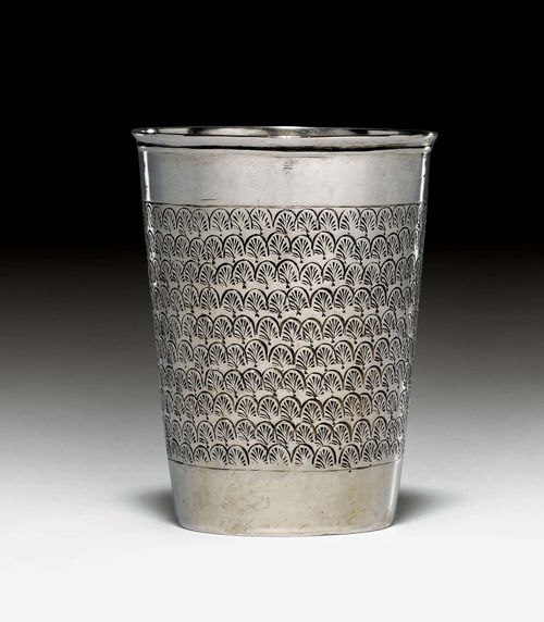 SMALL BEAKER,probably Guttstadt (East Prussia), end of the 17th century. Narrow, conical beaker with a flat bottom. Shaped lip edge. Wall with engraved palmette decoration. H. ca. 7 cm, 65g. Provenance: German private collection.