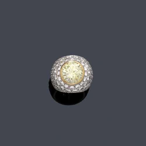 FANCY DIAMOND RING, ZIEGLER-ARDESSI. White and yellow gold 750. Elegant, large, convex band ring, the top set with 1  brilliant-cut diamond of 10.61 ct, fancy light yellow, VS1, in yellow gold prongs, and set throughout with 158 brilliant-cut diamonds weighing ca. 12.49 ct. Size ca. 55, with size adjustment insert. With Jeweller's certificate and SSEF Report No. 37947, August 2001.