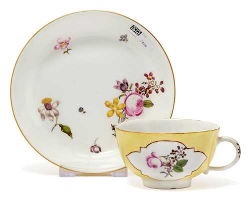 TEA CUP AND SAUCER, WITH A YELLOW GROUND AND GERMAN FLORAL DECORATION