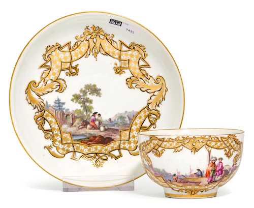 CUP AND SAUCER WITH A LANDSCAPE AND MERCANTILE PAINTING