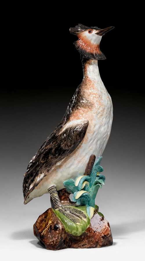 RARE MODEL OF AN &#39;AUGUSTUS REX&#39; GREAT CRESTED GREBE,Meissen, model by Johann Joachim K&#228;ndler, ca. 1734. Naturalistically modelled. Blue AR monogram on the unglazed base. H 48 cm. Restoration on both feet, beak and reed leaves, small chip on head feathers. Provenance: - From the Royal Collections, Friedrich August II. Elector of Saxony, King August III. (1696-1763), Dresden. - Gut Aabach, Risch am Zuger See.