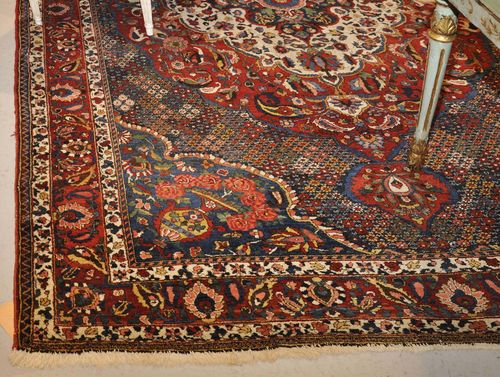 BAKHTIAR antique.Blue ground with red, white central medallion. The entire carpet with floral pattern. Red border, 212x300 cm.