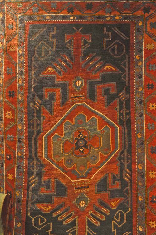 KAZAK old.Blue ground with massive central medallion, geometric pattern, red border, 176x280 cm.