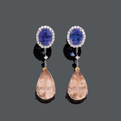 TANZANITE AND MORGANITE EAR PENDANTS. White gold 750. Decorative ear pendants with studs, each set with 1 drop-cut morganite, weighing ca. 12.60 ct in total, flexibly mounted below 1 oval tanzanite, weighing ca. 3.70 ct in total, within a border of brilliant-cut diamonds weighing ca. 0.50 ct in total. L ca. 4.2 cm.