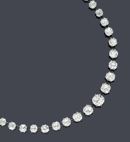 DIAMOND NECKLACE, ca. 1950. White gold 750, 60g. Fancy Rivière necklace set with 46 old European cut diamonds, graduated from 0.76 to 5.70 ct, weighing ca. 79.00 ct, average colour ca. J-K and average purity ca. SI1-P1, in a classic 8-prong chaton setting and connected to one another by fine gold bars. L ca. 48 cm. With Gemlab descriptions of the individual stones, 2010.