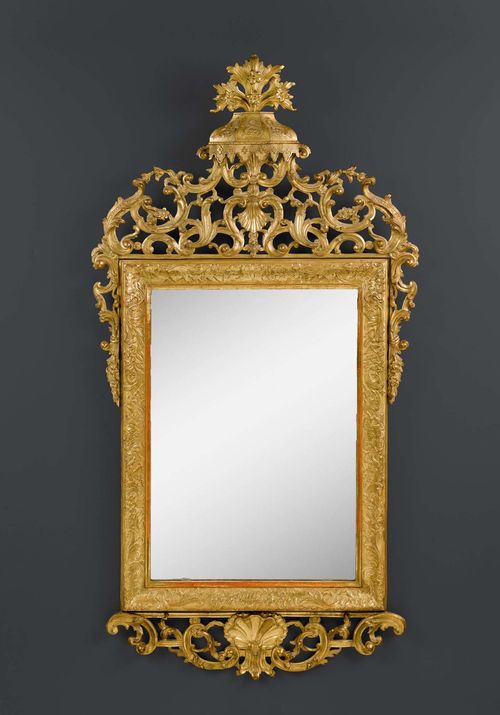 IMPORTANT MIRROR,Louis XV, North Italy circa 1760. Richly carved giltwood. H 176 cm. W 91 cm.