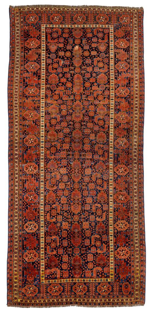 BESHIR antique.Dark ground patterned with rust coloured star motifs, signs of wear, 160x330 cm.