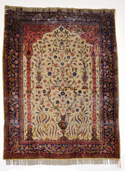 KESHAN SILK PRAYER, antique. Light green mihrab with dusky pink spandrels, finely patterned with vases, blue border with trailing flowers, strong signs of wear, fragile, with tears, 150x200 cm.