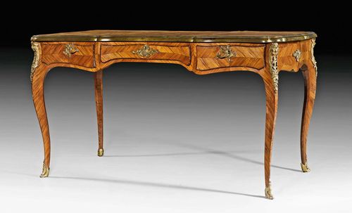 BUREAU PLAT,late Louis XV, in the style of J. DUBOIS (Jacques Dubois, maitre 1742), Paris, late 19th century. Tulipwood and rosewood veneer, inlaid with reserves and decorative frieze. The top lined with gold-stamped, brown leather and edged in bronze. The front with broad central drawer, flanked on each side by 1 drawer. Same, but sham arrangement verso. Gilt bronze mounts and sabots. 150x70x83 cm.