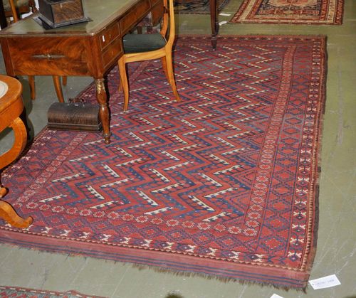 BESHIR antique. The red ground with geometric patterning. Some wear, 187x320 cm.