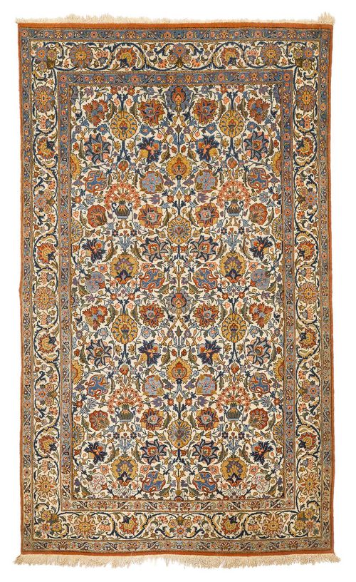 GHOM old.The white ground is patterned throughout with flowers and palmettes in harmonious colours. With a white border. Slightly worn, 130x210 cm.