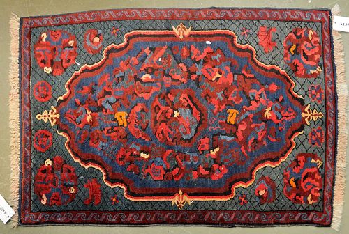 KARABACH old.The blue ground has a large central medallion and geometric patterning in bright colours. Good condition, 85x115 cm.