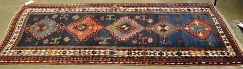 KASAK old.With a dark blue ground, five medallions and a white border. Good condition, 105x230 cm.