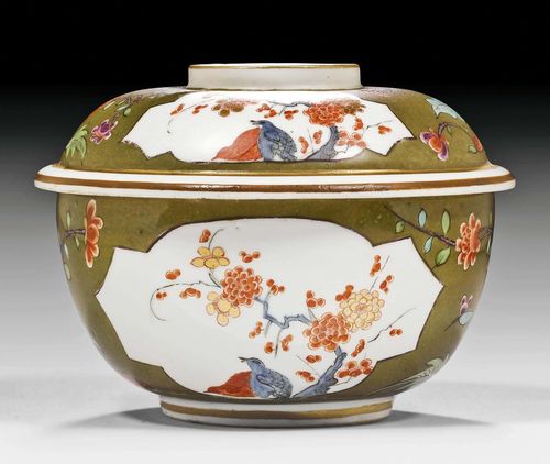 LIDDED BOX WITH KAKIEMON DECORATION AND PEA-GREEN GROUND, MEISSEN, CIRCA 1730-35.Underglaze blue sword mark. D 10 cm. Minor chip at the inside edge of the bowl and foot edge. Provenance: - Christie's Geneva, 9 May 1989, lot 74. - Private collection, Bern.