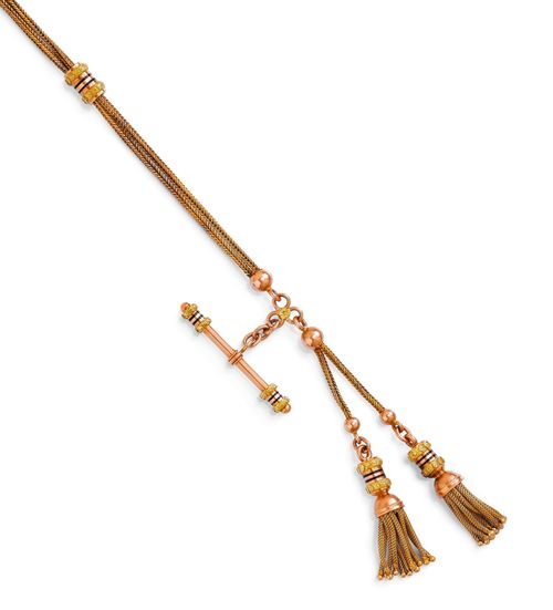 GOLD AND ENAMEL WATCH CHAIN, ca. 1840. Pink and yellow gold , 29g. Decorative, two-row fox-tail chain "en deux couleurs" with 2 cylindrical sliders and 2 tassels, decorated with black enamelled rings and applied flowers and leaves in yellow gold. L ca. 28 cm.