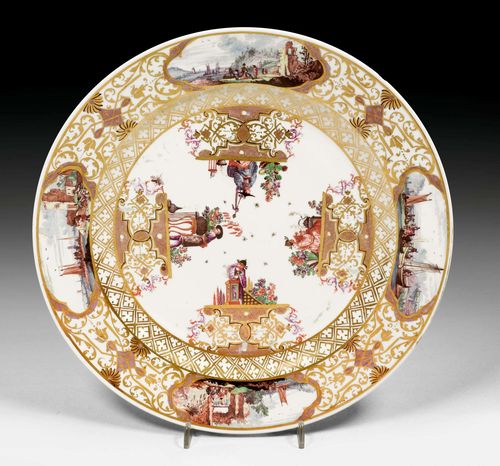 RARE PLATE WITH CHINOISERIE DECORATION, MEISSEN, CIRCA 1735.With four gold lattice consoles with Boettger luster and scroll ornament, each crowned by a Chinoiserie scene. Underglaze blue sword mark. D 27.9 cm. Small flat chip to the edge on the underside.