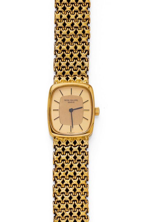 LADY'S WRISTWATCH, PATEK PHILIPPE, ELLIPSE, ca. 1975. Yellow gold 750, 56g. Ref. 4186 - 2. Elliptic, polished case No. 2743856. Gold dial with gold indices and hands with matte-finished centre. Hand winder, round movement No. 1269493, Cal. 16-250, with Geneva stripes. Integrated, braided, original gold band with signed Patek clasp, L ca. 17 cm. D 22 x 20 mm. With copy of the invoice by Mersmann Lugano, July 1975,
