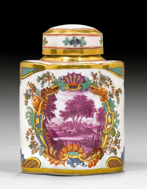 TEA CADDY WITH HAUSMALER DECORATION FROM BAYREUTH, MEISSEN, CIRCA 1740.Painting in the workshop of Johann Friedrich Metzsch. Both sides painted with a rich polychrome rocaille cartouche with landscape scene in purple camaieu. Underglaze blue sword mark, incised R. H 12cm.