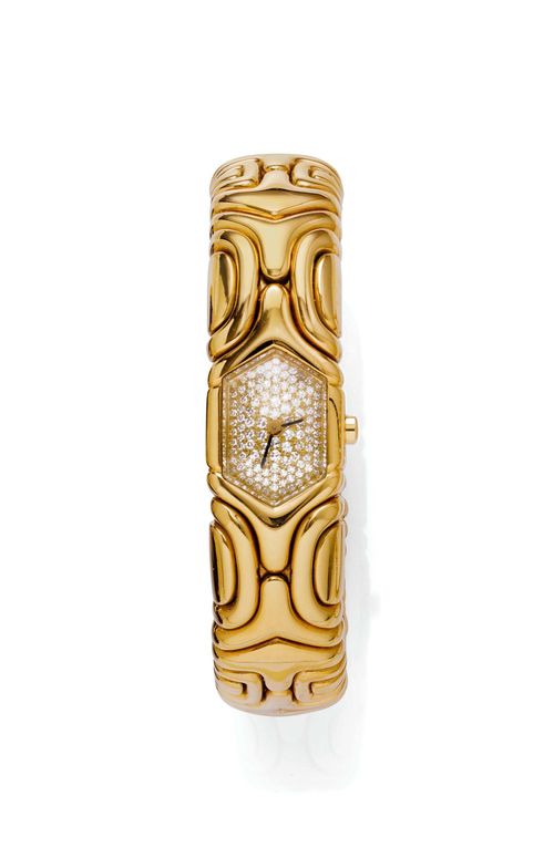 DIAMOND LADY'S WRISTWATCH, BULGARI ALVEARE, 1990s. Yellow gold 750, 112g. Ref. BJ 02, "Alveare" model. Case No. 523 integrated in the band. Hexagonal dial, pavé-set with numerous single-cut diamonds weighing ca. 0.80 ct and with black hands. Quartz movement No. 512-MBB. Flexible gold band. Signed Bulgari. Ca. 5.5 x 4.5 cm. With case and copy of the insurance estimate, December 2001.