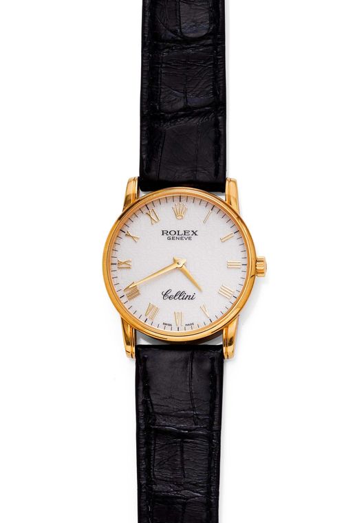 WRISTWATCH, ROLEX CELLINI, ca. 2000. Yellow gold 750. Ref. 5116. Classic, round case No. K 677271. Ivory-coloured dial with reliefed structure and applied gold-coloured Roman numerals, signed Rolex Genève Cellini, gold-coloured hands. Hand winding movement Cal. 1601, rhodium-plated, with Geneva stripes. Black leather band with original Rolex clasp in yellow gold 750. D 32 mm.