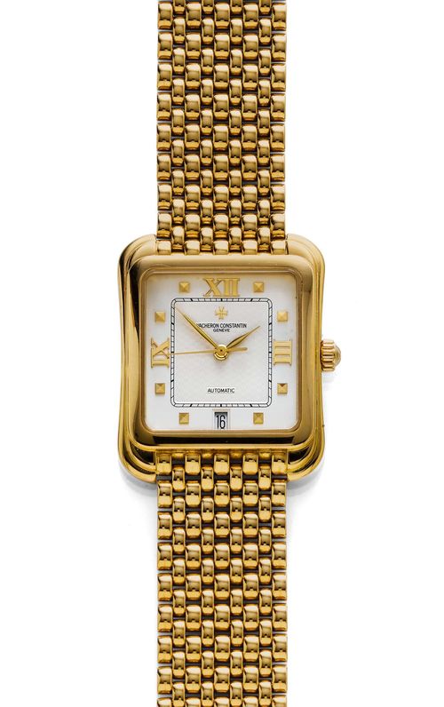 GENTLEMAN'S WRISTWATCH, AUTOMATIC, VACHERON & CONSTANTIN, TOLEDO, 1990s. Yellow gold 750, 130g. Ref. 42100. Rectangular case No. 708663, with convex sides and stepped profile. Silver-coloured dial with applied, gold-coloured indices, Roman numerals, and gold-coloured hands. Date at 6h. Automatic, movement No. 99009-897073, Cal. 1312. Original gold band with fold-over clasp. D 32 x 39 mm. With case.