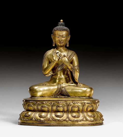 A GILT COPPER FIGURE OF BUDDHA DIPANKARA. Tibet, 15th c. Height 31.5 cm. Consecration plate replaced.