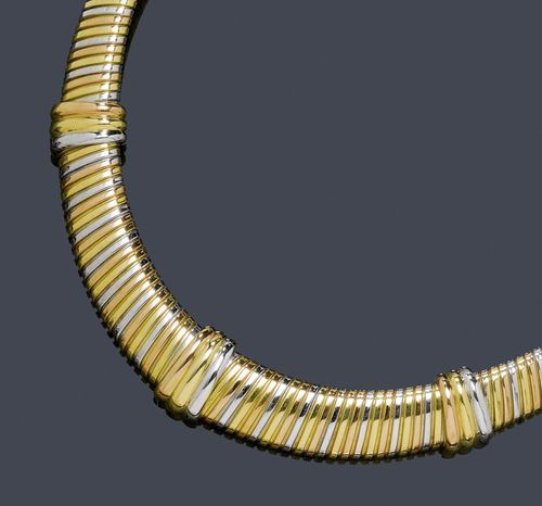 GOLD NECKLACE, CARTIER. Yellow, white and pink gold 750, 74g. Colomba model, Ref. 70/83300. Classic Tubogas model decorated with three additional ring motifs. Signed Cartier, No. 728510. L ca. 43 cm. With copy of insurance estimate, August 1991.