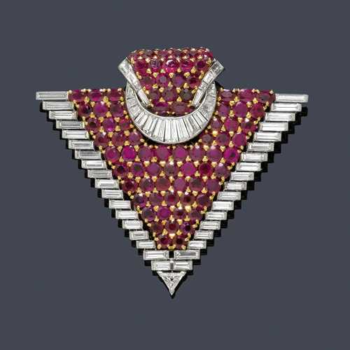 RUBY AND DIAMOND CLIP BROOCH, VAN CLEEF & ARPELS, ca. 1960. Platinum 950, yellow and white gold 750. Very fancy, triangular brooch, set throughout with numerous round rubies mounted in yellow gold, the border in platinum set with 36 graduated, baguette-cut diamonds and 1 triangle-cut diamond as the tip. With a band motif with numerous rubies and 21 baguette-cut diamonds on top. Total weight of the rubies ca. 14.00 ct and total weight of the diamonds ca. 9.00 ct. Signed Van Cleef & Arpels, No. 50532. Ca. 7 x 6.3 cm. With case.