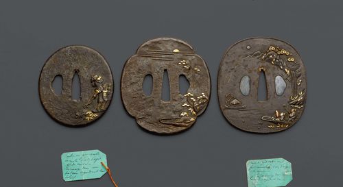 SEVEN TSUBA CARVED IN RELIEF WITH FIGURAL SCENES. Japan, Edo period, diameter 6.5-8.2 cm. (7)