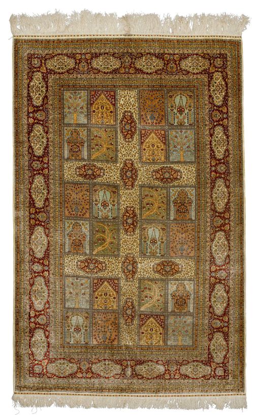 HEREKE SILK, GARDEN CARPET.Fineness: 10x10 knots/cm2. White ground with rectangular medallions, finely patterned with plant motifs in harmonious colours, red border with floral cartouches, in good condition, 202x315cm.