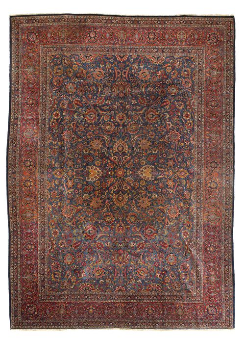 KASHAN antique.Blue central field patterned throughout with trailing flowers and palmettes in shades of pink, red border with trailing flowers, slight wear, 270x373cm.