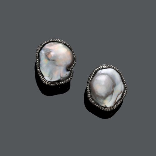 MABE PEARL AND DIAMOND EARRINGS. Silver and yellow gold 750. Each set with a mabe cultured pearl of ca. 27 x 23,5 mm Ø, within a brownish diamond surround, totalling ca. 1.80 ct.