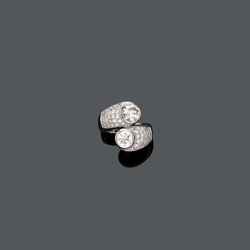 DIAMOND RING. White gold 750. Set with 2 brilliant-cut diamonds, totalling ca. 2.10 ct, ca. K/SI and pavé-set diamonds of ca. 0.70 ct. Size ca. 54.