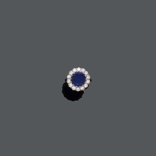 BURMA SAPPHIRE AND DIAMOND RING. Platinum 950. Set with a Burma sapphire of ca. 4.00 ct, not heated, within a brilliant-cut diamond surround, totalling ca. 1.40 ct. Size ca. 54.