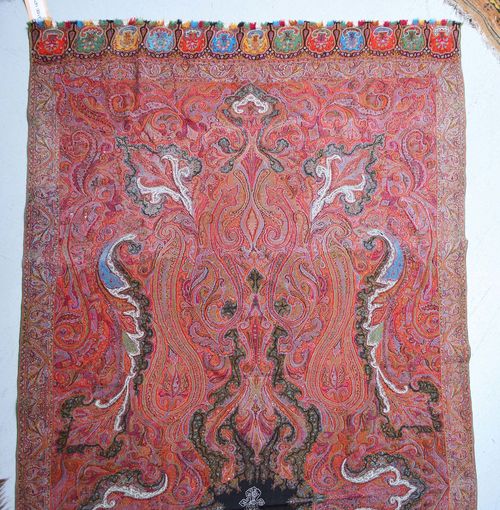 LOT OF 2 CASHMERE SHAWLS, old. Red ground, finely patterned with boteh motifs in harmonious colours, 135x290 cm.