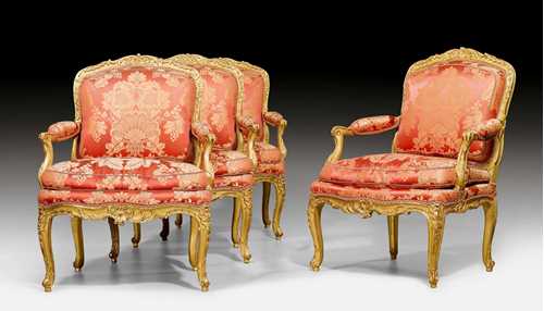 SET OF 4 LARGE FAUTEUILS &quot;A LA REINE&quot;, Louis XV, signed GOURDIN (Jean Baptiste Gourdin, ma&#238;tre 1748), Paris ca. 1750. Beech, moulded and finely carved with shells, cartouches and decorative frieze, and gilt. Red silk cover with flowers and leaves. Cushion. Gilding restored, with some losses. 71x57x48x97 cm. Provenance: - from a European collection.