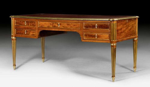 BUREAUPLAT, Louis XVI, Paris, ca. 1800. Mahogany. Top lined with red leather edged in brass. Front with 1 central drawer with 2 drawers on each side. Same but sham arrangement on verso. 2 sliding ledges. Bronze sabots. 178x76x75 cm.